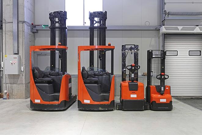 forklifts carrying heavy loads in a factory